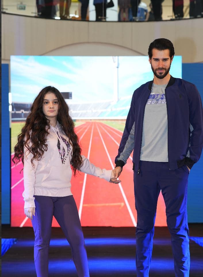 Amin Alsharq team on stage at a Skechers event
