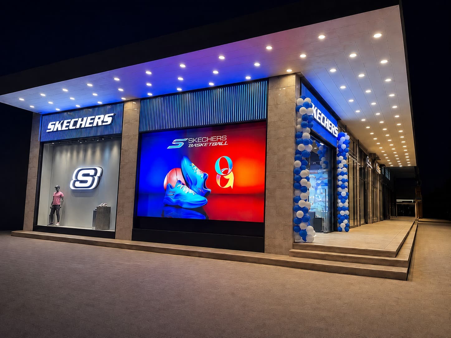 Skechers storefront at night with a basketball campaign screen